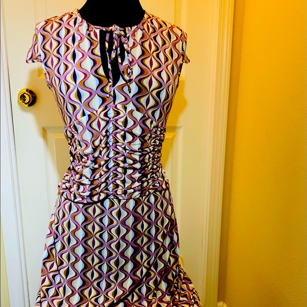 Cap sleeve dress with self tie round neckline. Rushing in the front size S